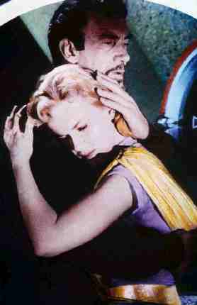 Walter Pidgeon e Anne Francis in una scena del film